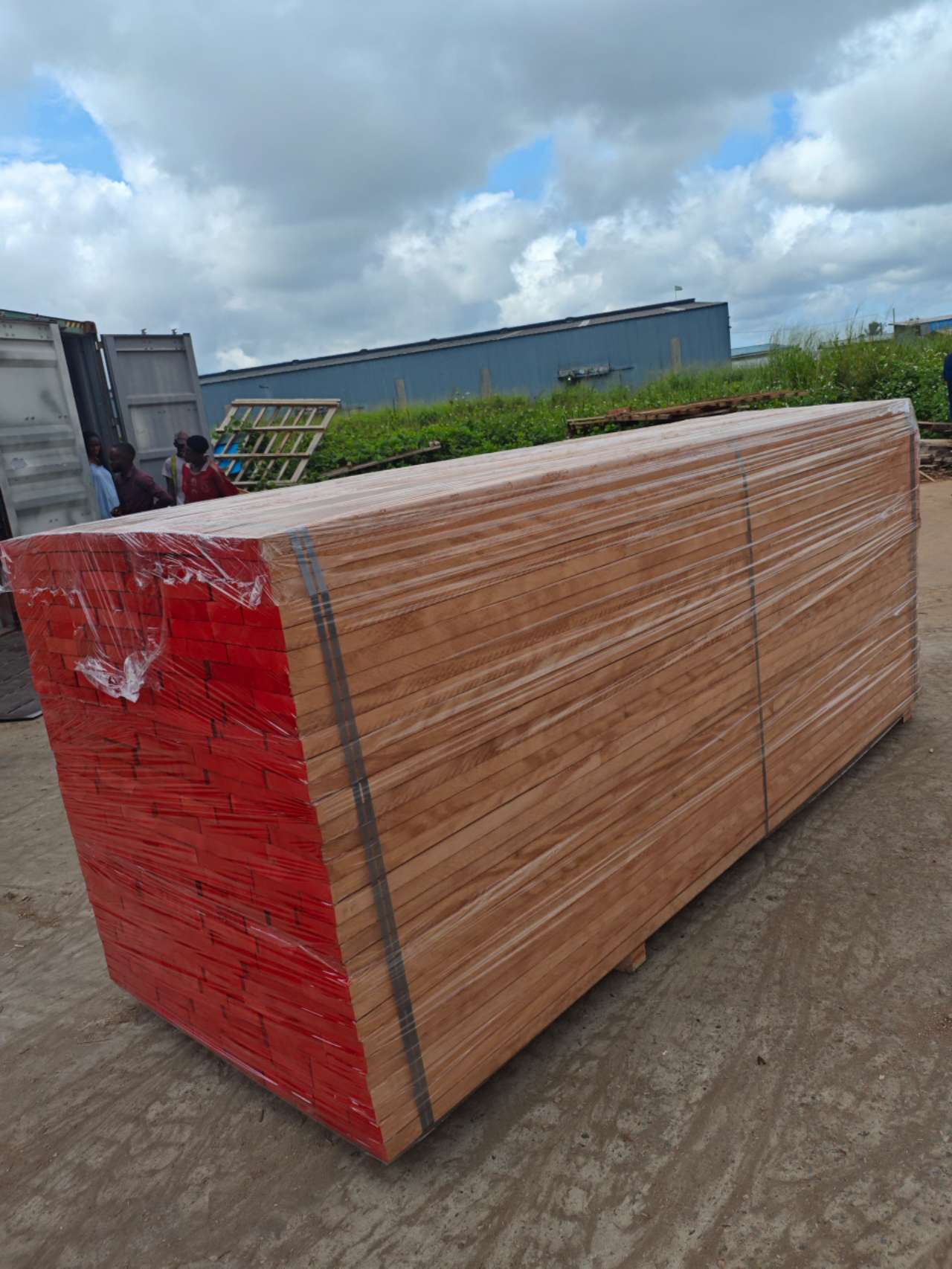 Wrapped stack of Okoumé sawn timber okoume plywood ready for shipment